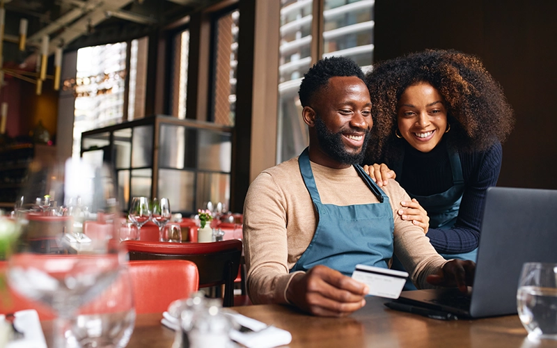 business person holding a debit card