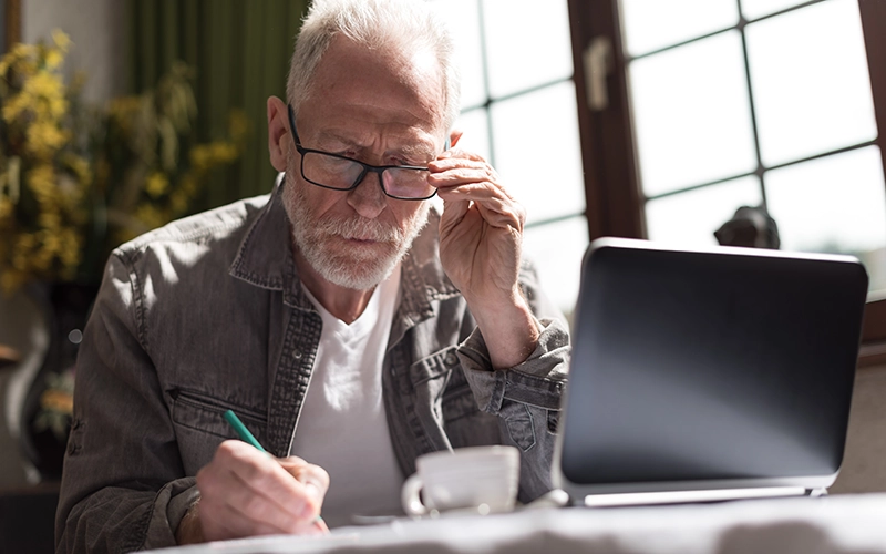 concerned man on laptop