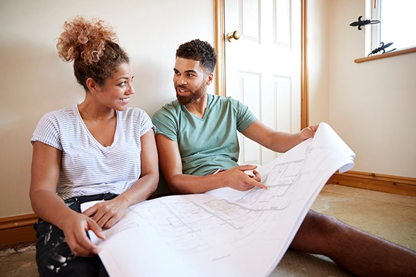 couple looking at blueprints