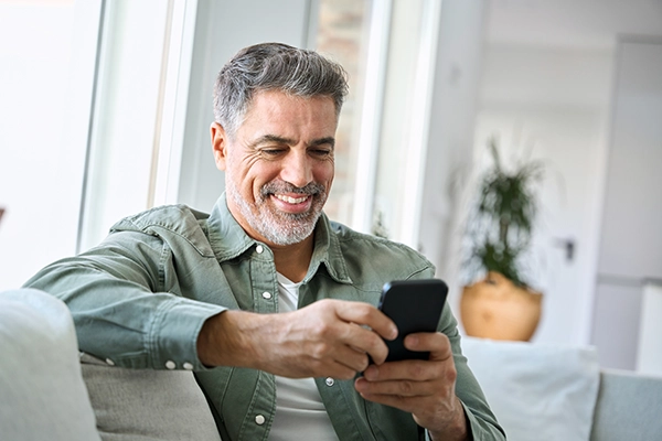 middle aged man looking a phone